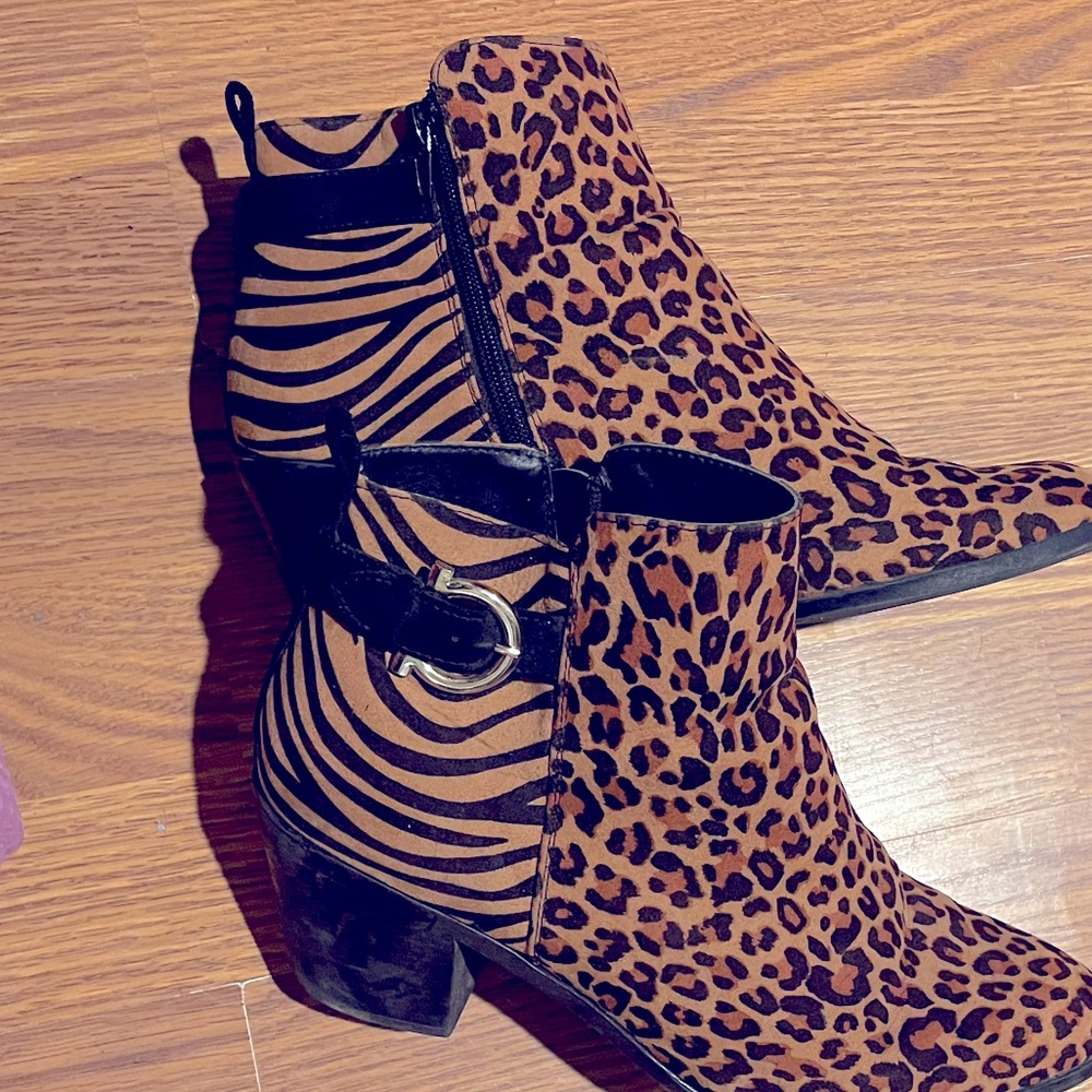 Animal print ankle boots with heals.  In perfect shape size 12